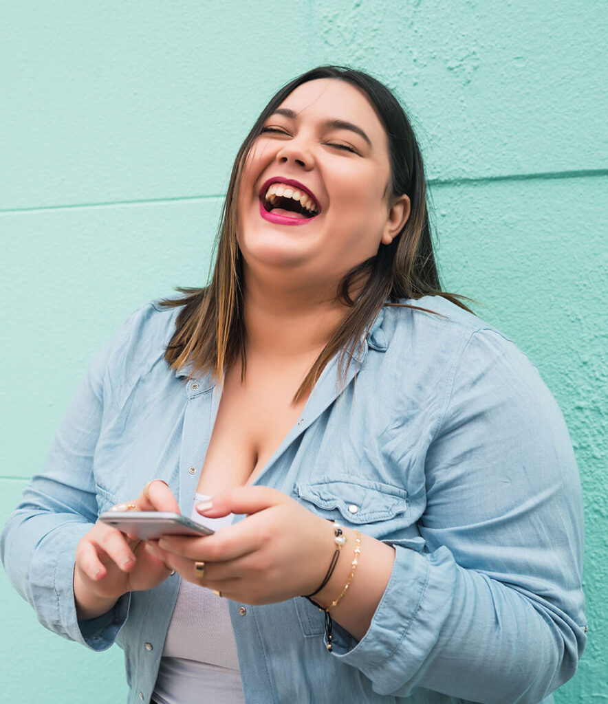 young-plus-size-woman-using-her-mobile-phone-2024-10-16-06-53-44-utc (1)